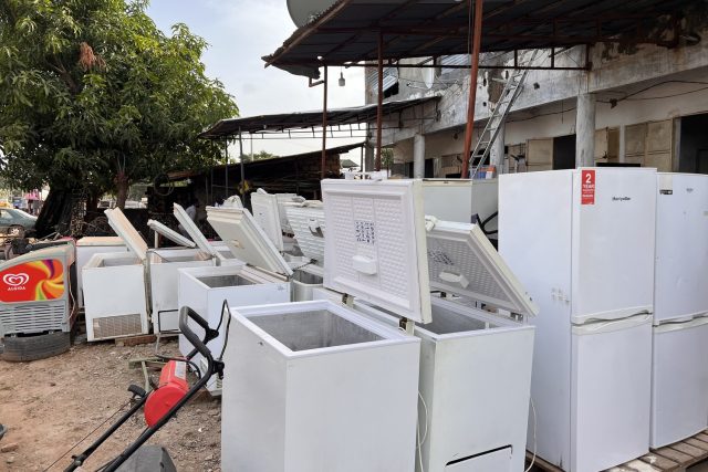 Refrigerators and chest freezers in an open-air appliance market