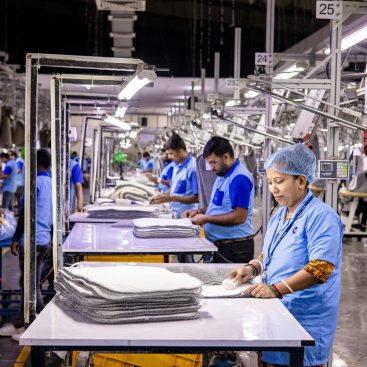 Workers on a garment production line in an Indian factory